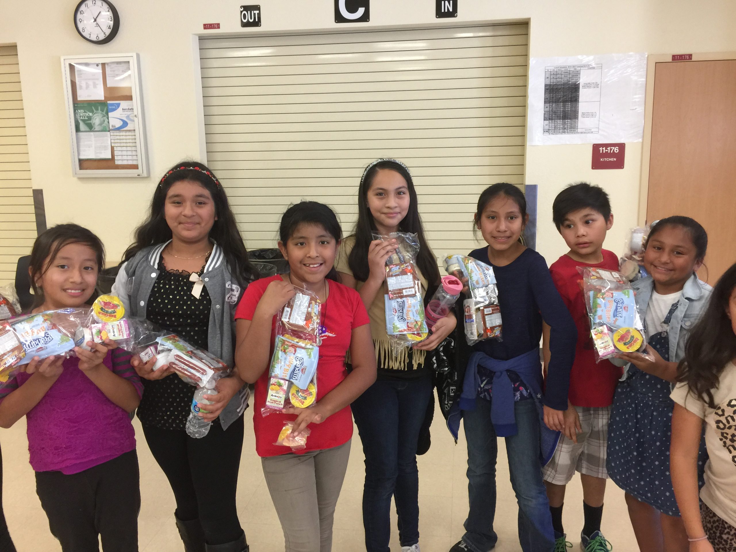 Photo of kids holding their bags of food